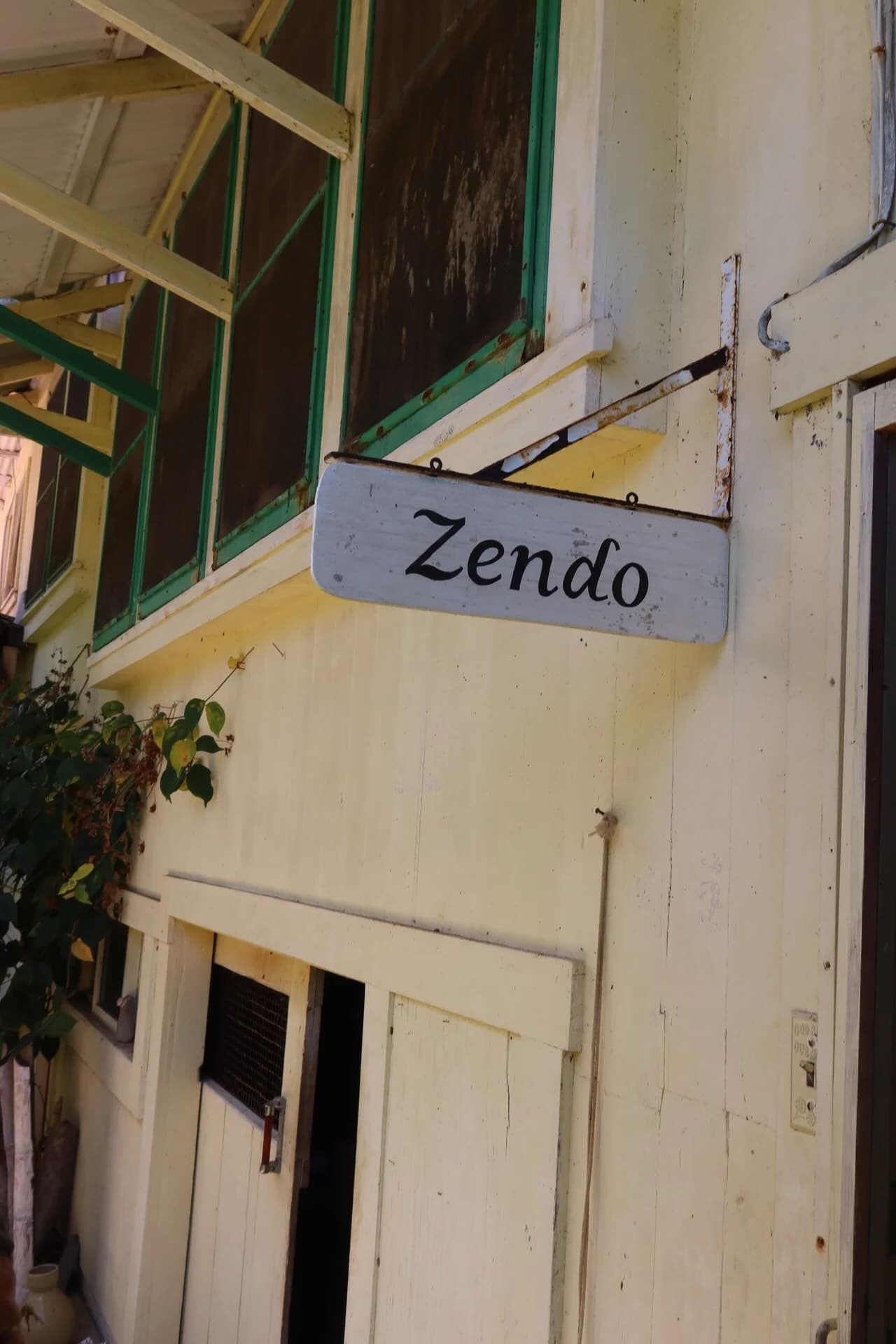 Exterior of the zendo surrounded by tropical plants in Hakalau, Hawaii