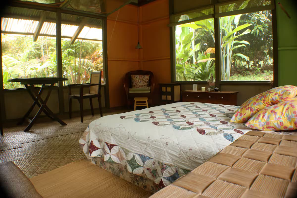 Interior view showing bed and screened open-air design