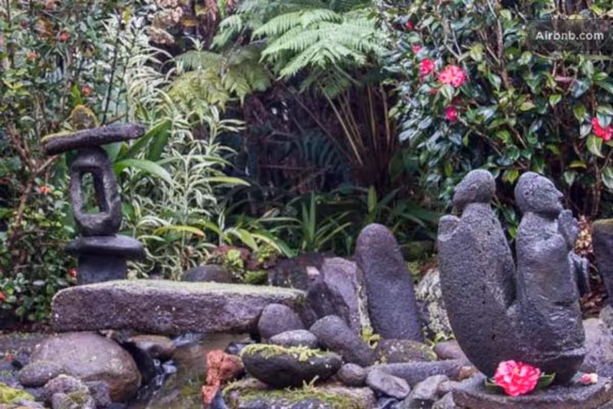 Outside view of the cottage with statues